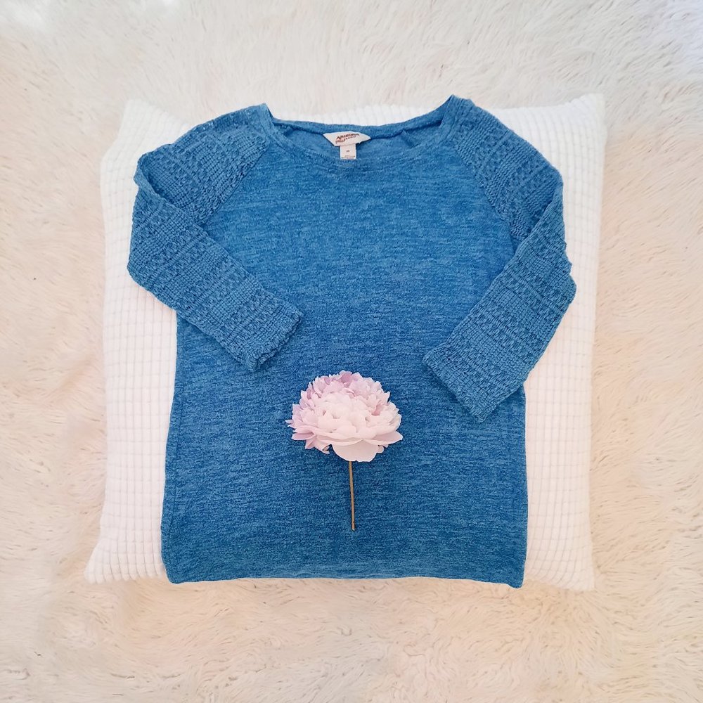 Blue pullover with crocheted arms